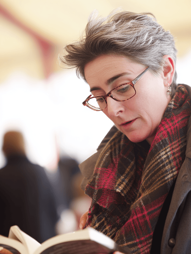 Festival reader in tweed coat